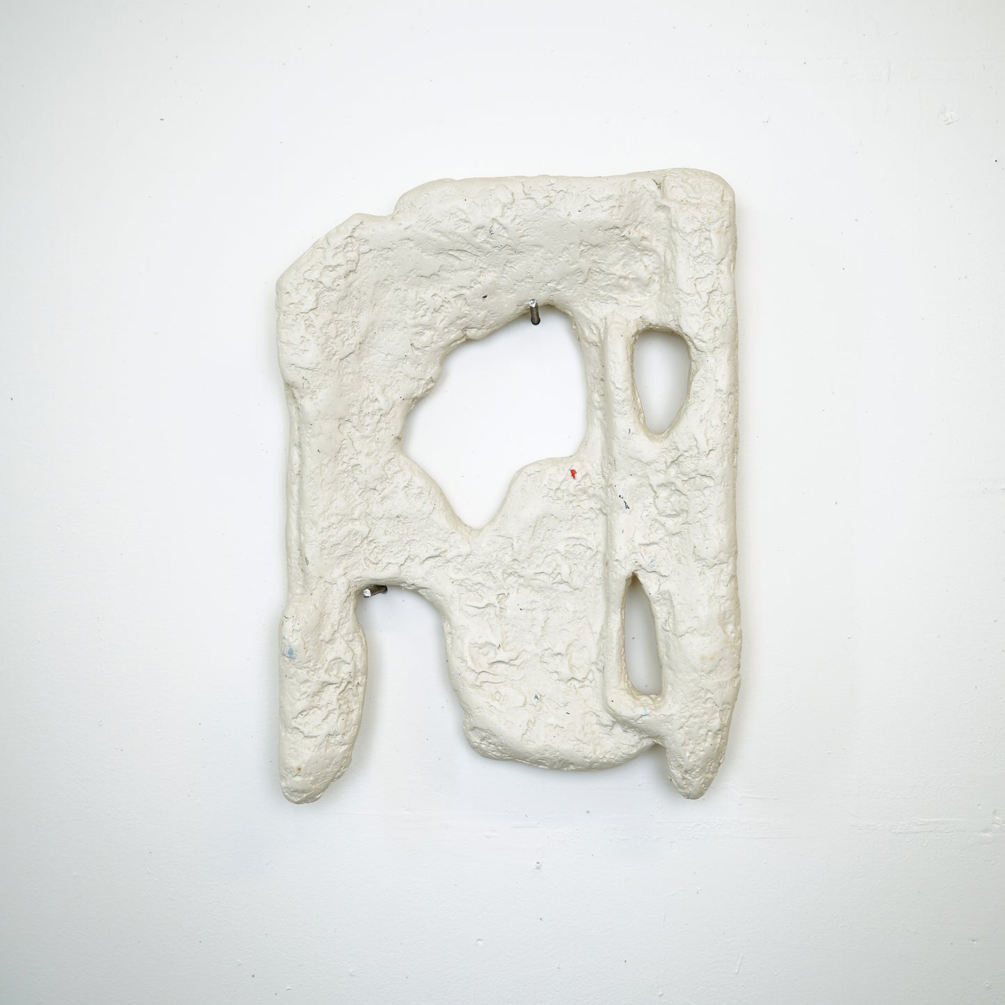 Untitled (The Packaging VII), 2025 <br><small> Plaster, pigment, rubble, recycled posters and construction debris on found styrofoam, 170 x 30 cm, €1035</small>