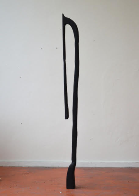 The ashes in the electric fireplace are still warm no.5, 2025 <br><small>wood and tar, 165 x 12 x 7 cm, €1250</small>